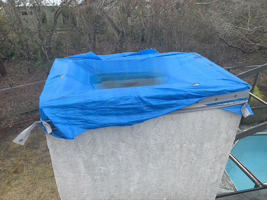 Chimney With Tarp to protect from Water