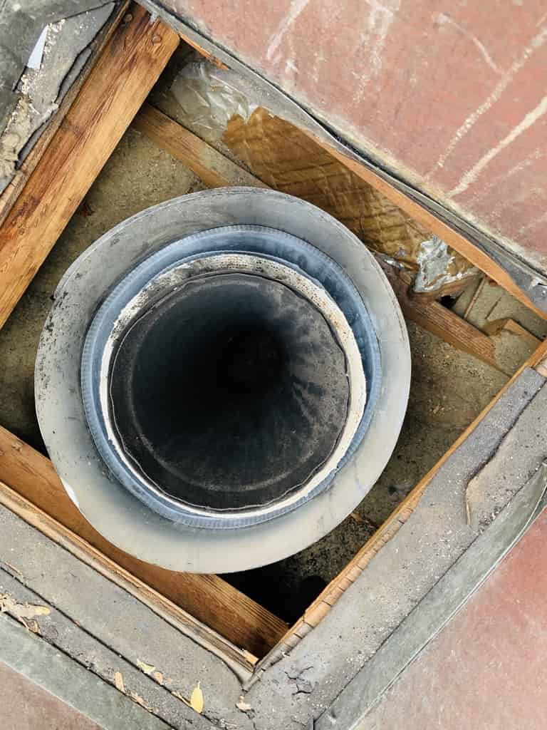 Cover image: a photo from above of a chimney liner.