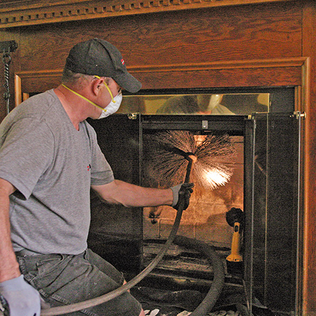 A technician inspecting a chimney 