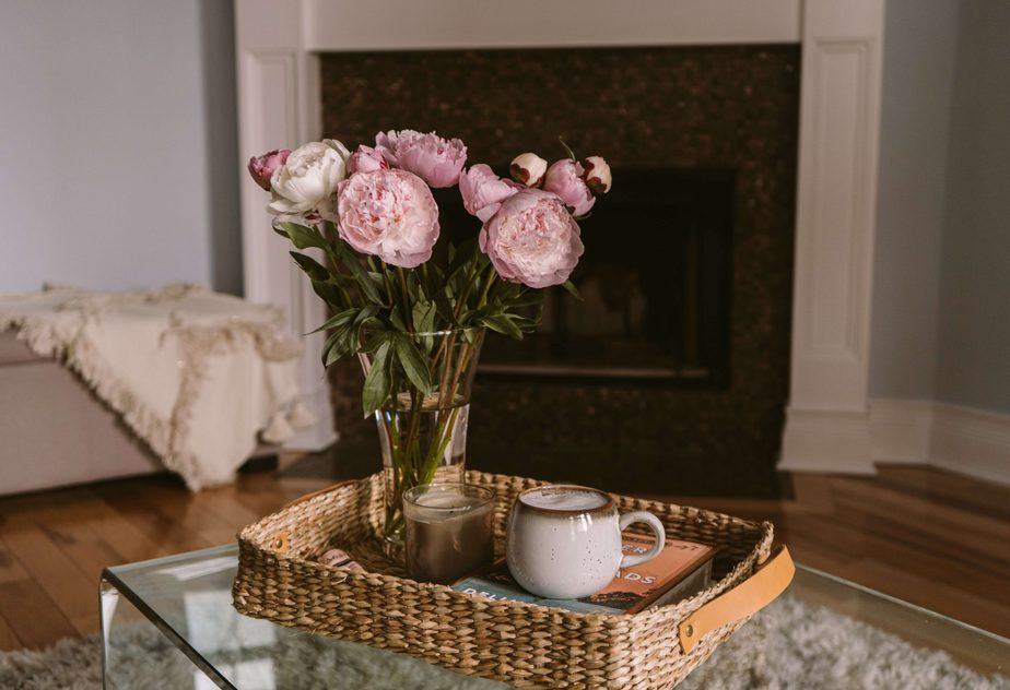 spring flowers on coffee table in front of fireplace